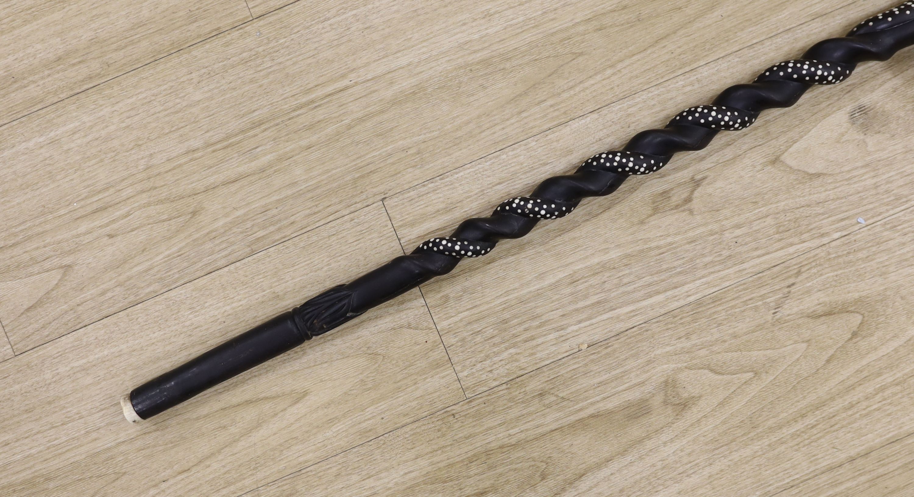A late 19th/early 20th century Ceylonese carved ebony ‘elephant’ walking stick, 90cm